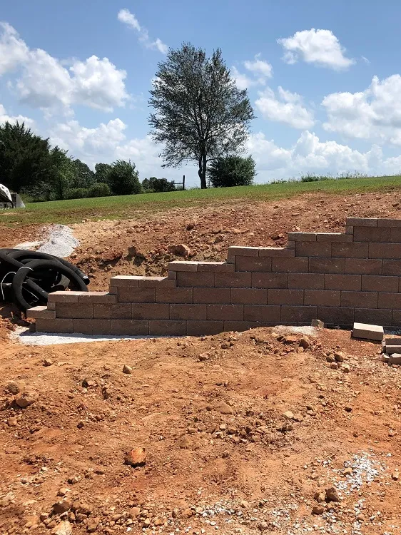 Residential retaining wall with stone finish